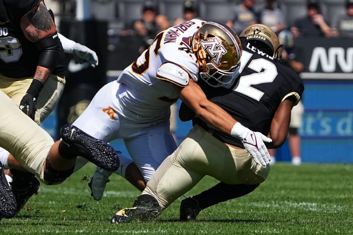 Minnesota linebacker Mariano Sori-Marin (55) tackles Colorado quarterback Brendon Lewis (12).